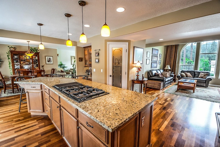 Open concept kitchen and living space remodel with granite countertops and hardwood floors